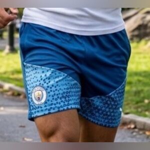 Puma Men's Blue Athletic Shorts with Crest Accent